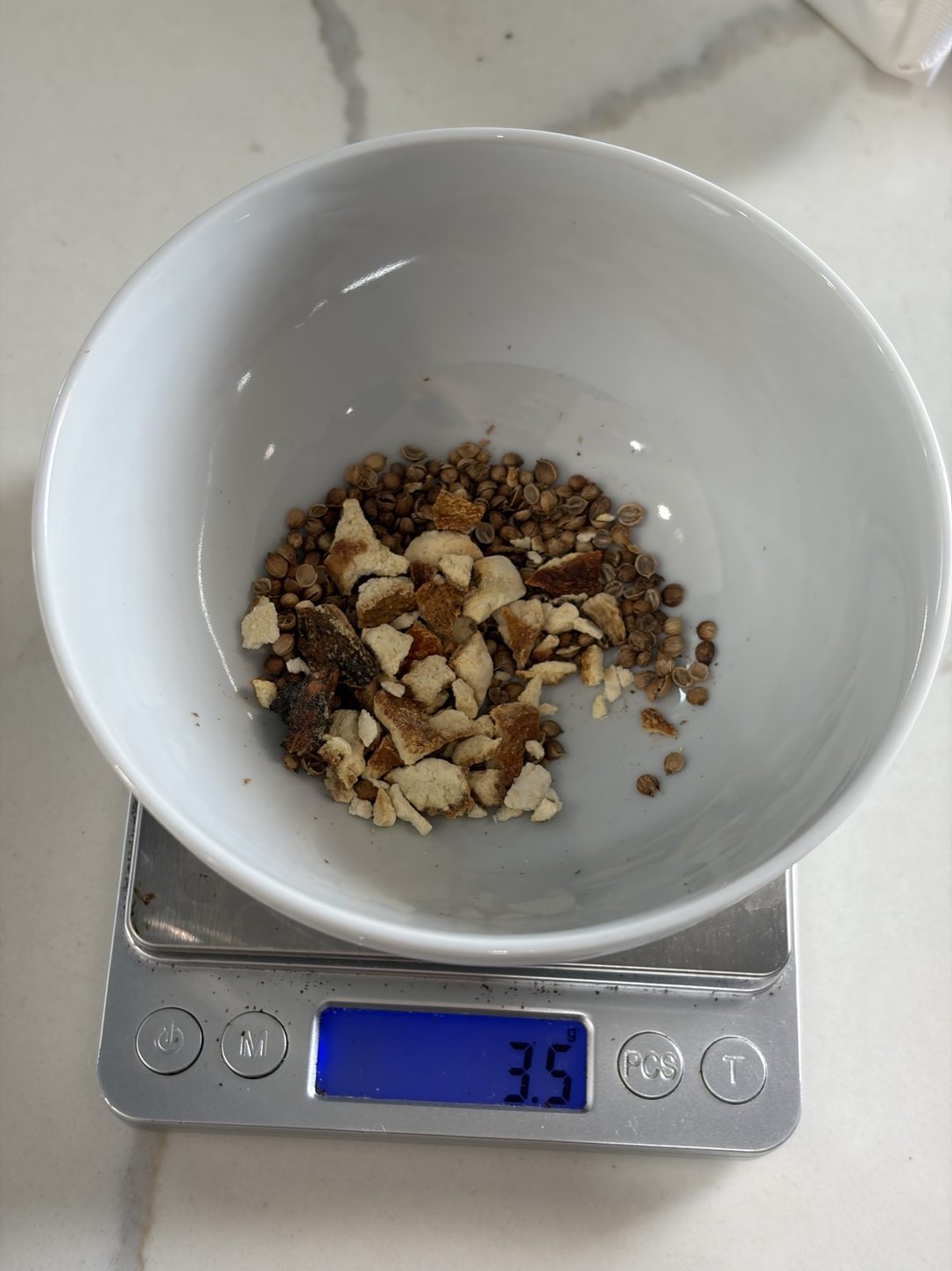 3.5 g of bitter orange peel measured after resetting the scale