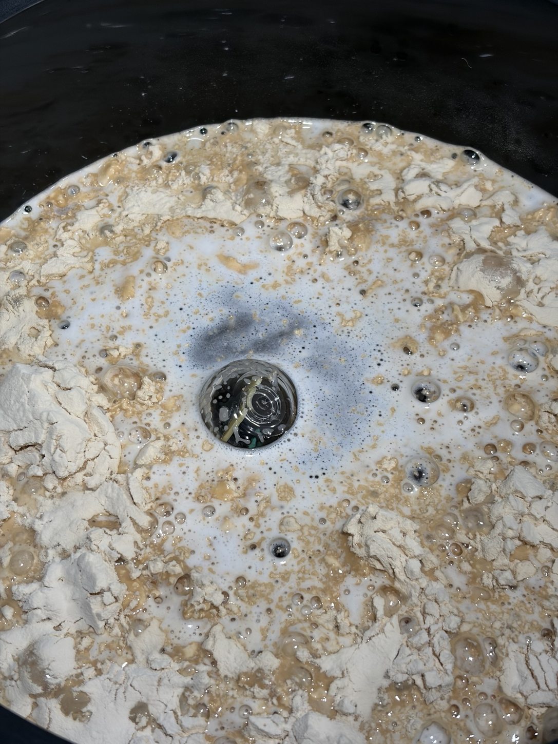 RAPT Pill floating amid wet BrewArt ingredients