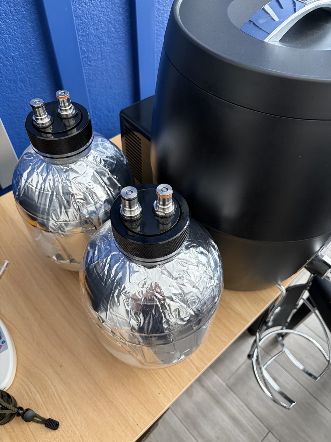 Two clear PET keg containers beside the BeerDroid